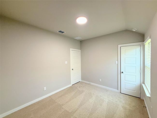Unfurnished room with light carpet and vaulted ceiling | Image 23