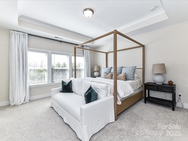 Spacious Primary Suite on upper level with tray ceiling, crown molding, tons of natural light, private bath & walk in closet! | Image 20