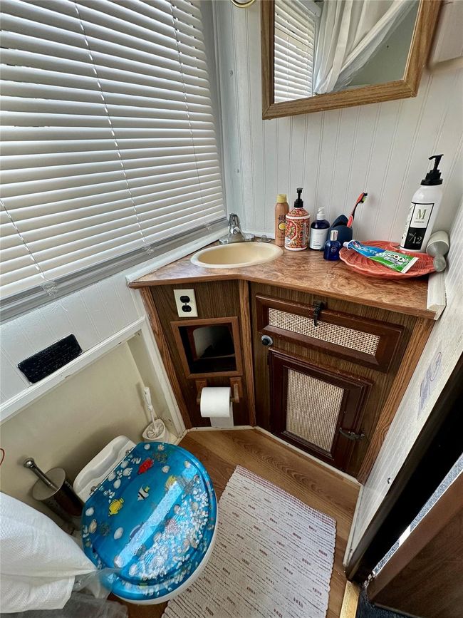 Detailed view of vanity and wood finished floors | Image 12