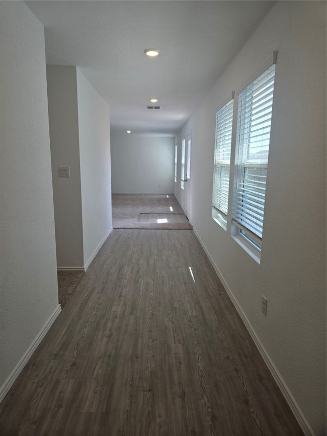 Hallway featuring dark wood-style floors and baseboards | Image 9