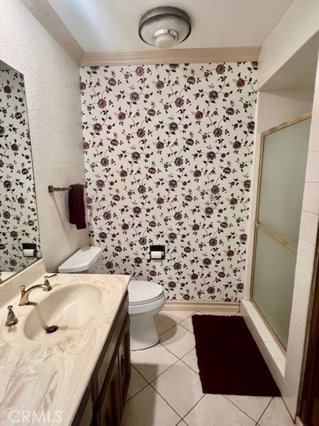 Downstairs full bathroom acrooss from bedroom | Image 21