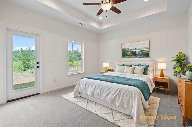Carpeted bedroom with access to outside, recessed lighting, a ceiling fan, and a raised ceiling | Image 17