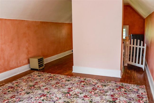 Additional living space with lofted ceiling, baseboards, and dark wood-style flooring | Image 40