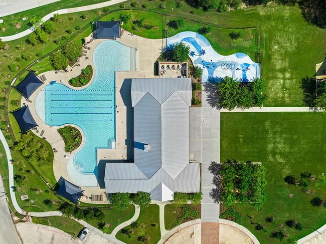 Neighborhood club house that features a pool, splashpad, park, and gym. | Image 37
