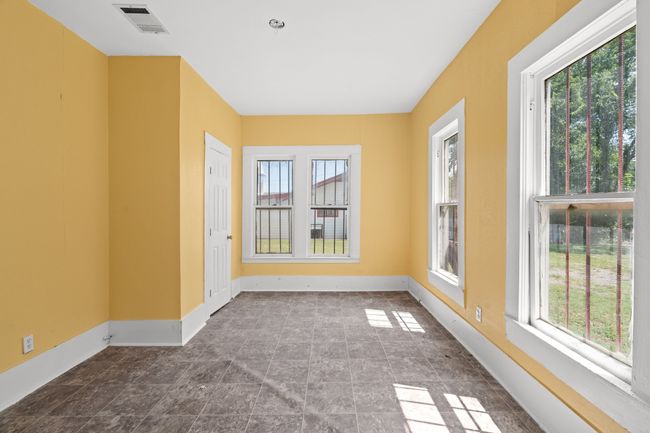 Empty room featuring healthy amount of natural light and baseboards | Image 5