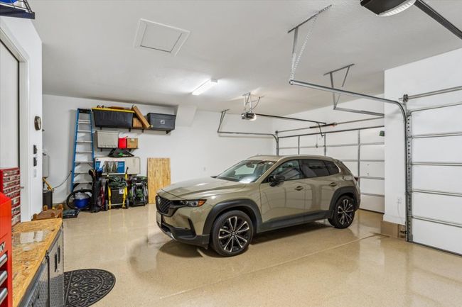 Extra features in garage include Epoxy Garage Floor, Storage Shelves & Water Softener | Image 31