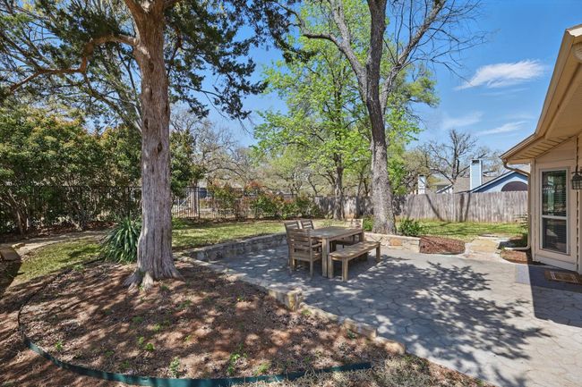 Fenced backyard featuring a patio and outdoor dining space | Image 29