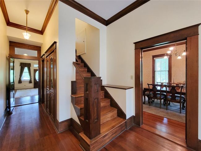 Upstairs features a cozy den, a study, and three/four additional bedrooms. | Image 21