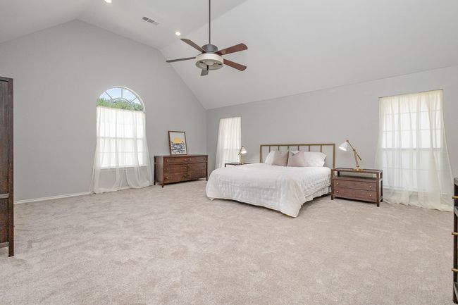 Huge primary bedroom with vaulted ceiling, ceiling fan | Image 17