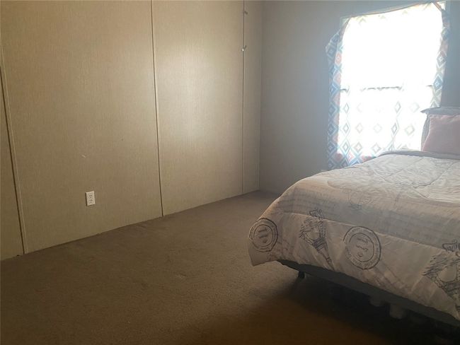 Bedroom with carpet flooring | Image 11