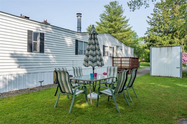 View of grassy yard featuring outdoor dining area | Image 19