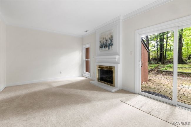 Family room with gas fireplace and sliders to back patio | Image 11