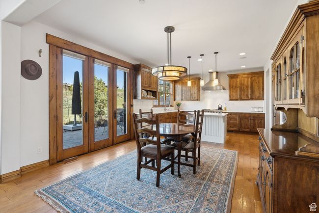 Dining space with french doors, recessed lighting, baseboards, visible vents, and hardwood / wood-style flooring | Image 6
