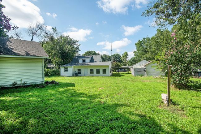 View of green lawn with an outdoor structure | Image 26