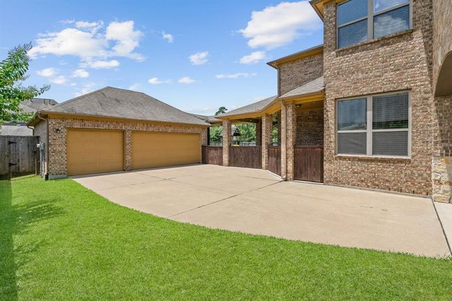 Spacious three car garage. | Image 41