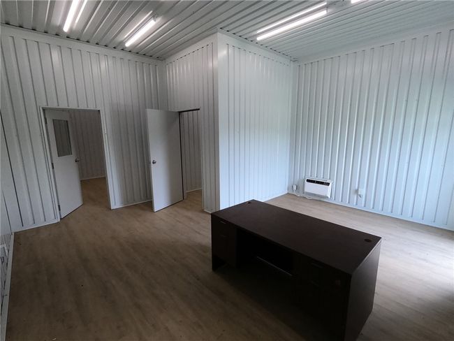 Spare room featuring wood finished floors | Image 7