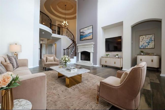 This Virtually Staged view of the living area will surely get your creative juices flowing for placement of treasured pieces, perhaps with attention to art niches and unique architectural structures. | Image 8
