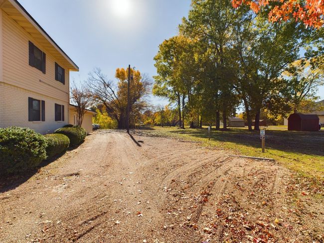 View of dirt / gravel driveway | Image 19