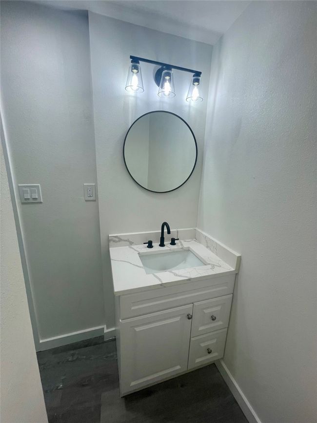 Bathroom featuring vanity and wood finished floors | Image 14