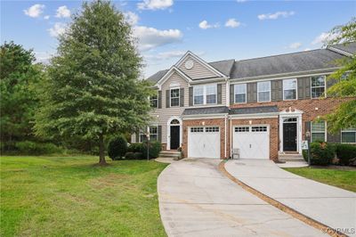 View of front of house with a front yard and a garage | Image 2