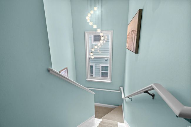 Staircase with carpet floors and baseboards | Image 16