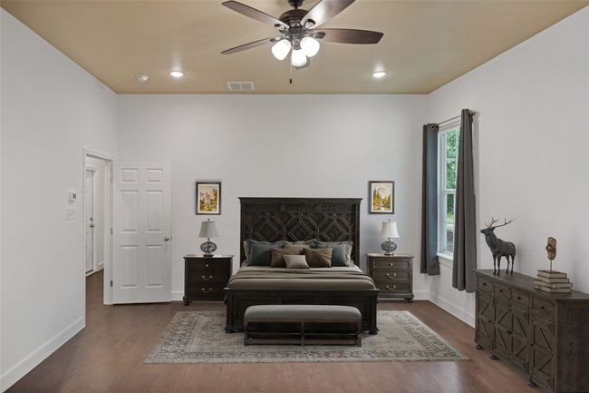 Bedroom featuring dark wood-type flooring, recessed lighting, and a ceiling fan | Image 13