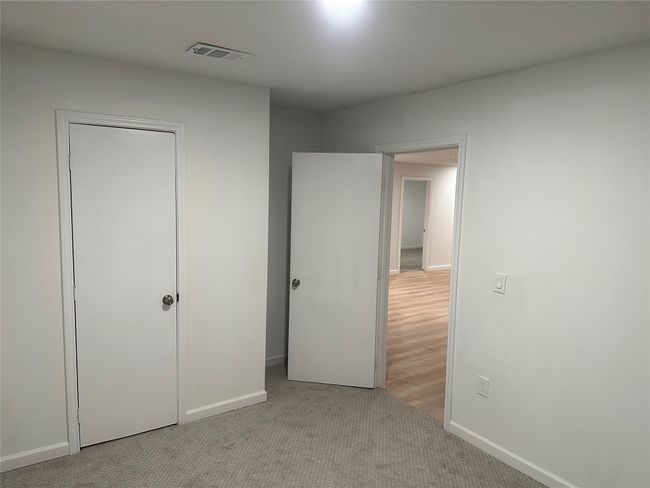 Unfurnished bedroom featuring visible vents, carpet flooring, and baseboards | Image 30
