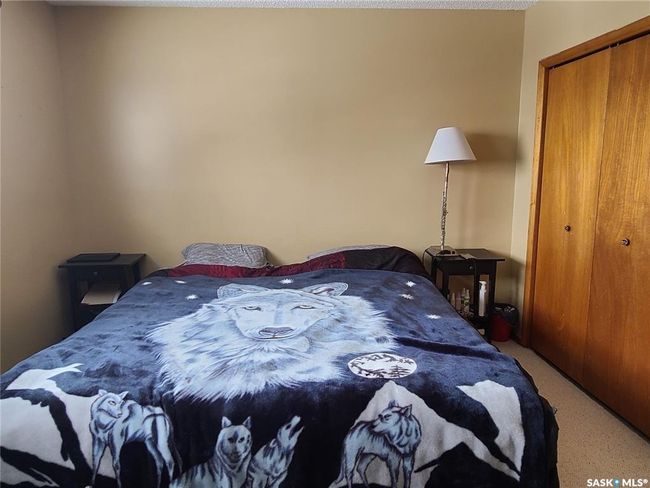 Carpeted bedroom with a closet | Image 18