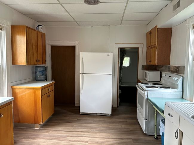 Large Kitchen. Bathroom door on right. Back door to left | Image 34