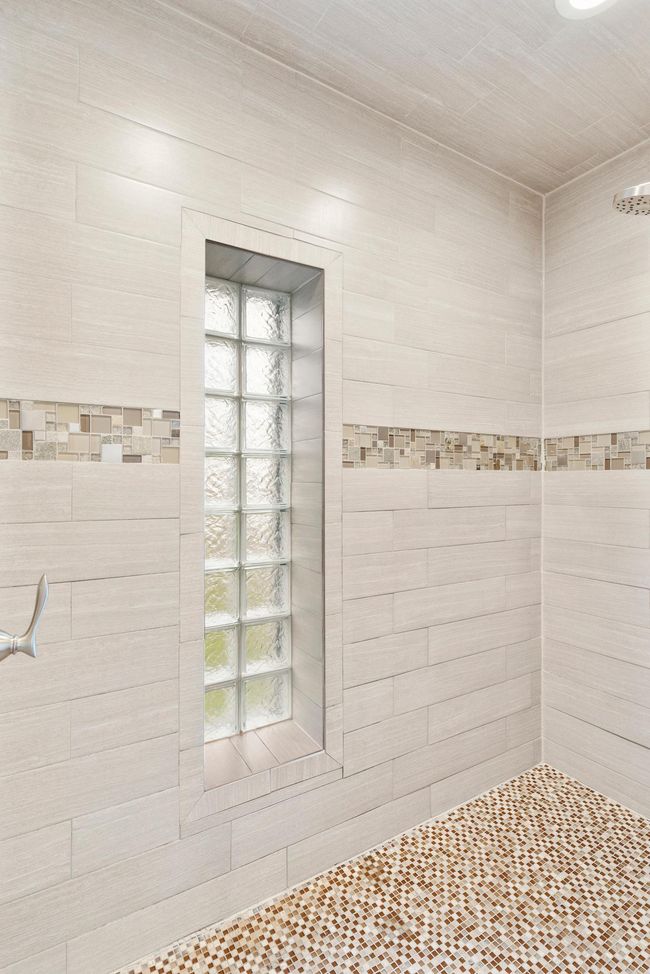 Beautiful tile work in the primary bathroom shower. | Image 25