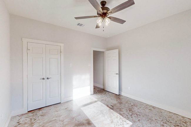 Unfurnished bedroom featuring visible vents, a closet, baseboards, and a ceiling fan | Image 33
