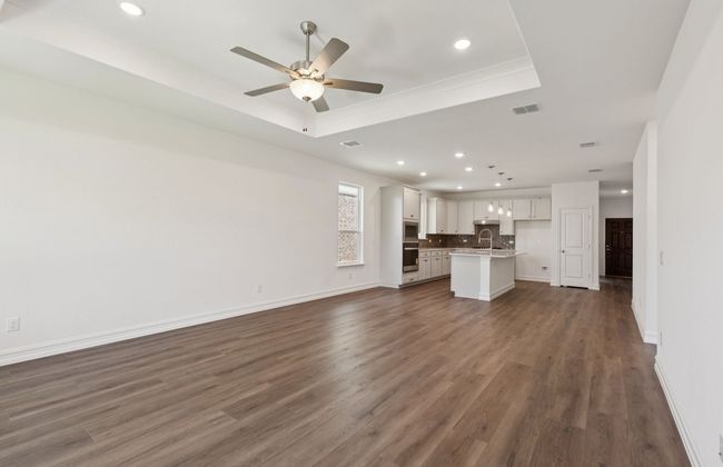 Open concept gathering room creating a spacious and inviting atmosphere *Real home pictured | Image 8