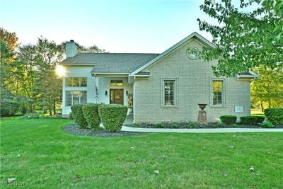 View of front of property featuring a front lawn | Image 1