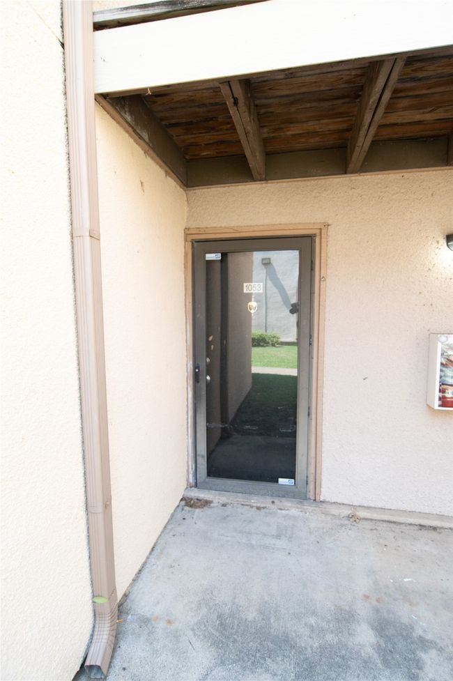 View of exterior entry featuring stucco siding | Image 4