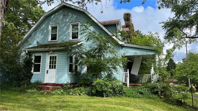 so much potential with this home. The back of the home has a mud room entry or a side porch | Image 5