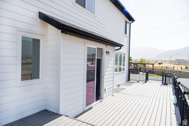 Wooden deck featuring a mountain view | Image 5