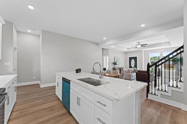 Stunning kitchen with quartz countertops, ample cabinetry, and stainless steel appliances included. | Image 16