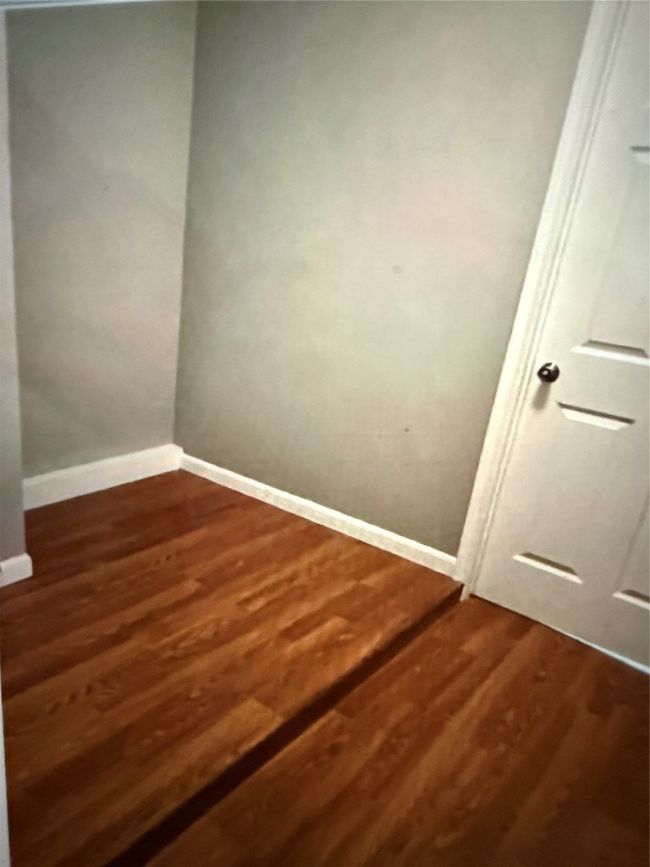 Flex space leading to garage, storage or small office, featuring dark wood finished floors | Image 23