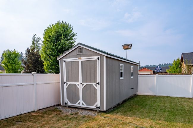 View of shed featuring a fenced backyard | Image 21