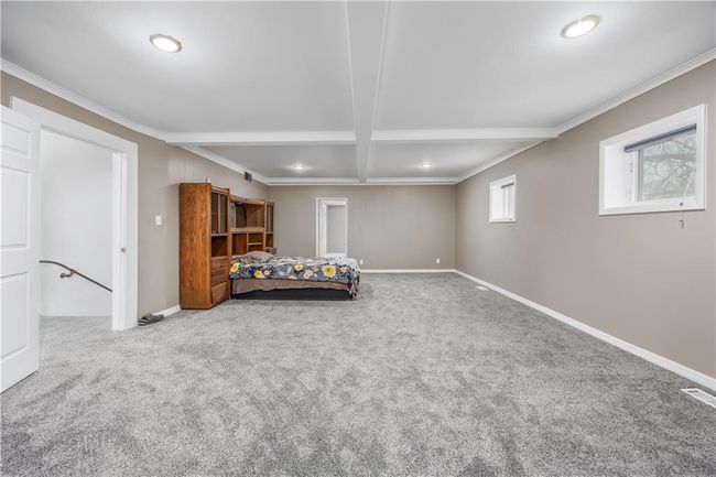 Unfurnished bedroom featuring carpet, baseboards, and ornamental molding | Image 33