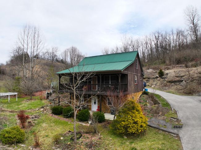Madison County mini-farm with 3BR, 2 BA home, finished apt in basement, extended family apt over the garage and a studio apt at the end of the garage. (It is will be finished before closing. | Image 1