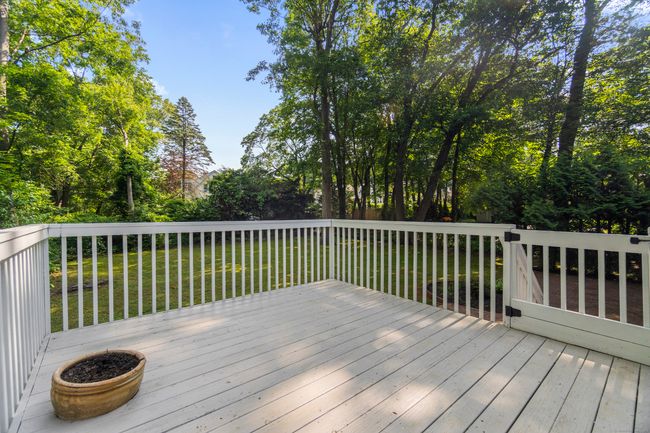 Deck off of your dining room with stairs down to the patio and backyard | Image 7