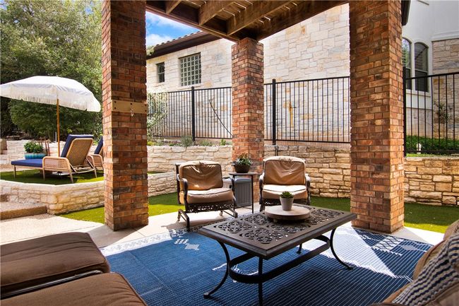Plenty of outdoor living spaces. Enjoy this covered patio with plenty of shade! | Image 35
