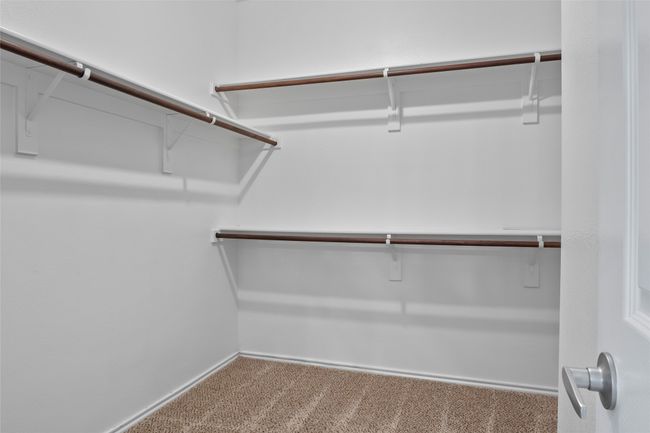 Spacious closet with carpet floors | Image 30