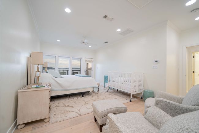 Bedroom with crown molding, wood finished floors, recessed lighting, and a ceiling fan | Image 36