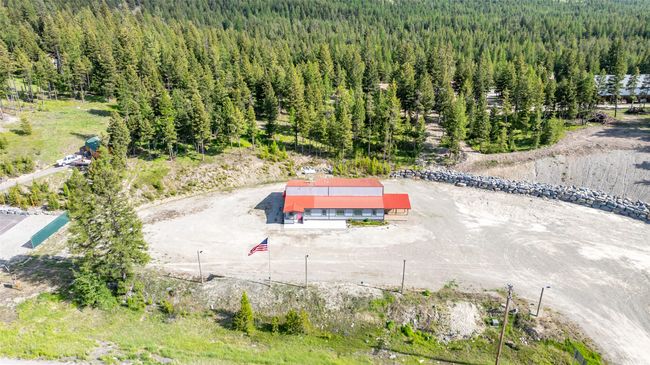 View from above of property with a heavily wooded area | Image 66
