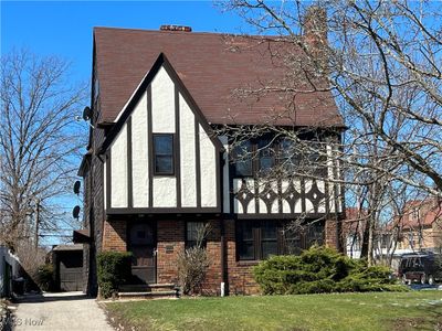 View of front facade featuring a front lawn and a balcony | Image 1