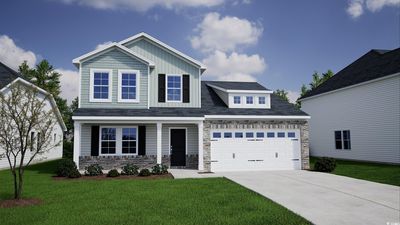 Craftsman house featuring a front yard and a garage | Image 1