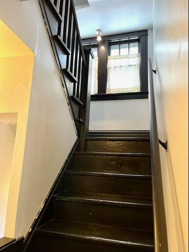 The hallway from the living room to the kitchen. | Image 11