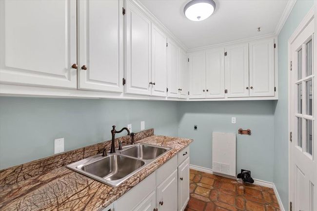 Kitchen with sink and white cabinetry | Image 5